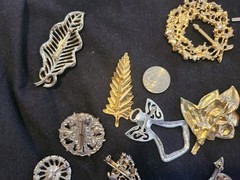 12 vintage Brooches. 1.5 inches – 3 inches big.