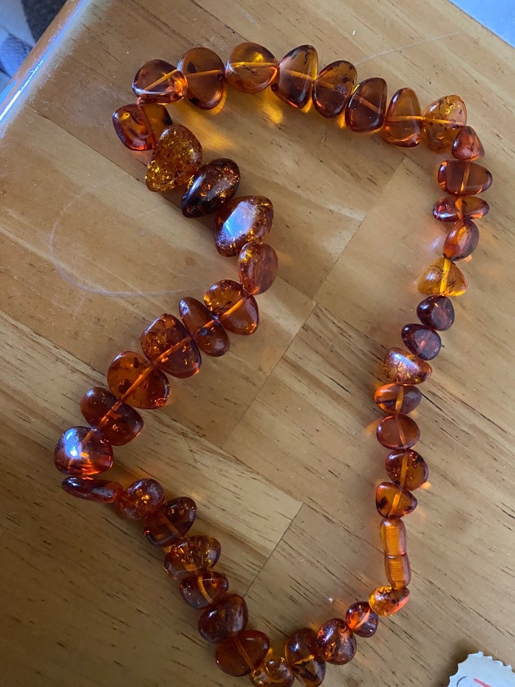 Braun amber necklace 21″ long with amber lock. New. Latvia.