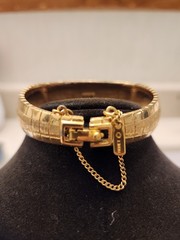 Monet gold tone bracelet with safety chain w/shiny and matte finish