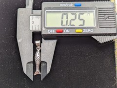 925 Sterling Silver Fish Pendant / Charm. Weighs 1.1 Grams. 1.13″ Long.
