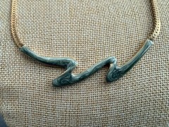 Gold tone Zig Zag Necklace With Green Stones