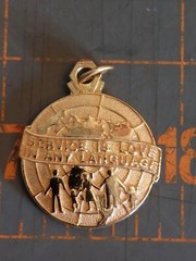 Vintage Altrusa Charm Pendant Gold Tone Service is Love in any Language Biennium