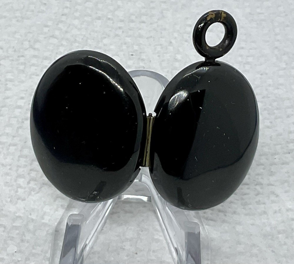 A Vintage Hinged 2 Sided Hair Mourning Pendant. Black Enameled Good Condition