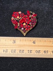 Gold tone Red heart brooch.