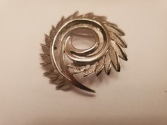 Silver-Tone Spiral Brooch Features A Brushed Feather Design