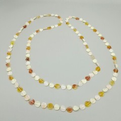 Vintage Long Single Strand Orange and Cream Beaded Necklace Plastic Leaf Shapes