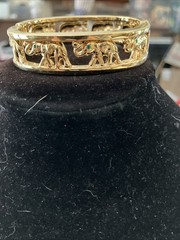 gold tone elephant hinged bracelet Trunks Up Green Eyes Unsigned