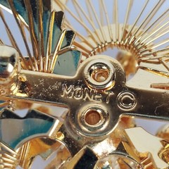 Vintage Monet Gold Tone Open Metal Wire Clear Rhinestones Flower Brooch Pin