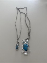 Vintage-style silver-tone owl pendant featuring a faux turquoise