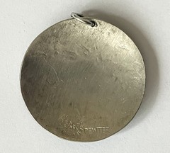 Rolf Buodd pewter pendant, circular with star in centre 45mm in diameter