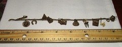 Adorable Gilded Silver Vintage Charm Bracelet. Approximately 8″ long.