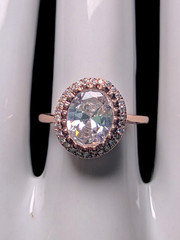 Vintage Inspired Simulated Diamond Solitaire with Simulated Diamond Halo with As