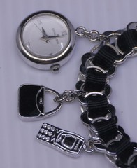 L – OLDER ANNE KLEIN SILVER TONED CHARM BRACELET WITH WATCH, 7 INCHES