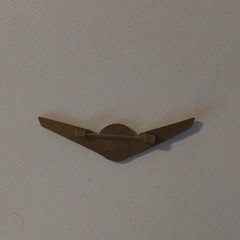 Stoffel Seals Signed Wing Brooch Pin Gold Tone Green Round Bezel Center