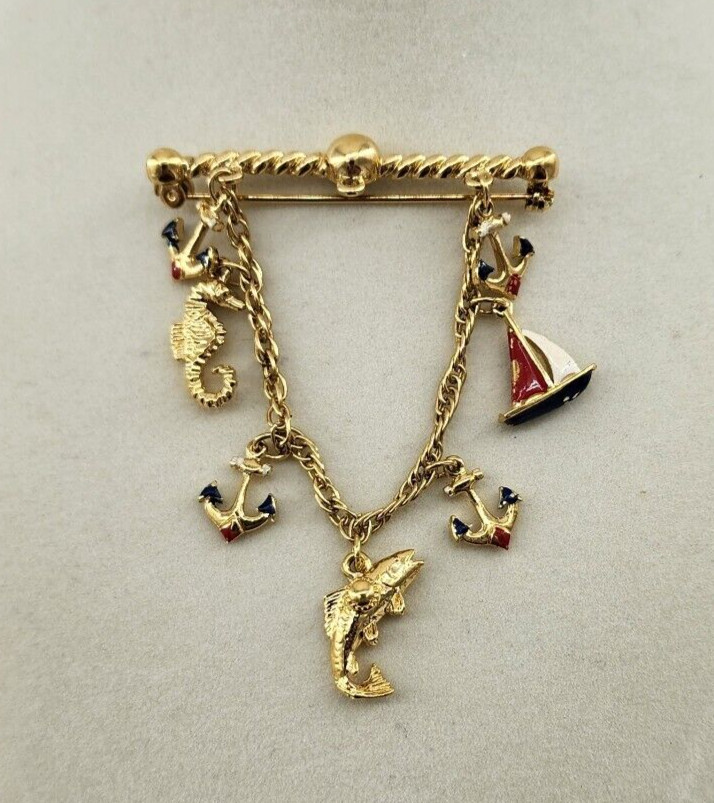 Unbranded Gold Tone Brooch Bar With Chain and 7 Nautical Themed Charms