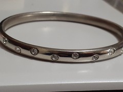 Crystal polka dot bangle bracelet Silvertone flush set stones eternity band