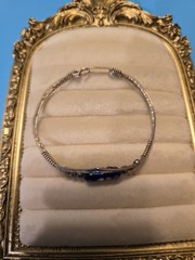 Mexico Alpaca silver hinged bangle bracelet featuring a colorful enameled flower