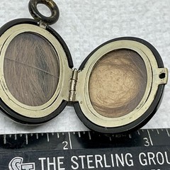 A Vintage Hinged 2 Sided Hair Mourning Pendant. Black Enameled Good Condition