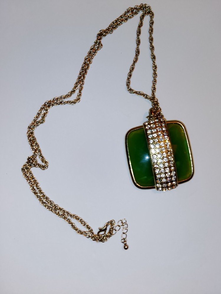 Nice faux jade gold tone necklace with strip of rhinestones. 19″ total 2″ stone