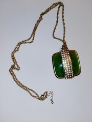 Nice faux jade gold tone necklace with strip of rhinestones. 19″ total 2″ stone