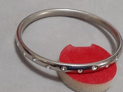 Crystal polka dot bangle bracelet Silvertone flush set stones eternity band