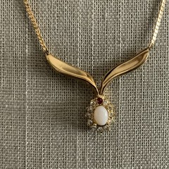 Vintage man made low grade opal and garnet v necklace in gold tone
