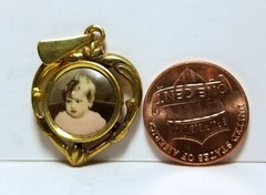 Little boy, photo heart-shaped pendant, c. 1920s, hand colored/tinted celluloid