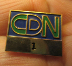 letters logo c d n lapel pin