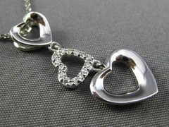 ESTATE .06CT DIAMOND 14KT WHITE GOLD 3D OPEN TRIPLE HEART FLOATING LOVE PENDANT