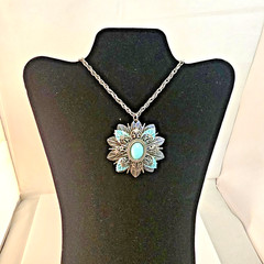 Vintage Southwest style Silver Tone Medallion pendant: Turquoise color cabochon