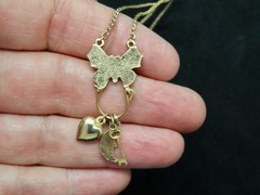 Vintage “1928 Jewelry” Gold Tone w/Butterfly Charm Holder w/Charms