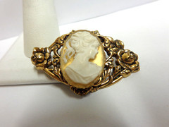 vintage gold tone cameo pin in floral frame sz 2 in wide wgt 9.6 grams girl bust
