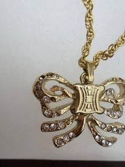 Authentic CELINE Paris Gold Tone Bow Crystal Pendant Necklace 26 in.