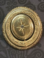Vintage 1970s Avon Spinner Brooch Gold Tone Rotating Starburst Rhinestone Signed