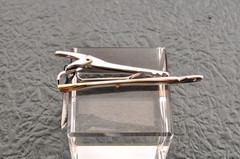 Near mint, gold and Cufflinks and silver tie clip, “Yves Saint Laurent”, case.