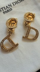 Authentic Christian Dior monogram logo clip-on earrings from the 1990s – Gold