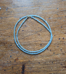 17″ 2.5 mm faceted aquamarine necklace with 14 k gold clasp