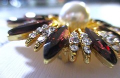 gold tone starburst brooch with purple & clear zircons + a large faux pearl