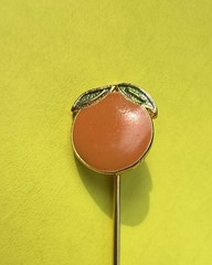 A Happy Vintage Orange Stickpin