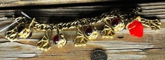 1950’s Gold tone Red Glass Gripoix charm bracelet 7.5 charms measure 1″ x 0.66″
