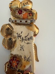 VINTAGE ASIAN BROOCH WITH CARVED FACE AND JEWLEL SIGNED