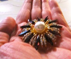 gold tone starburst brooch with purple & clear zircons + a large faux pearl