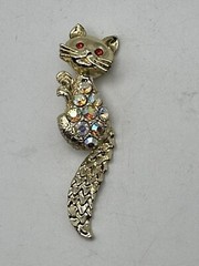 Bejeweled Feline Brooch Gold Tone With Man Made Aurora Borealis And Red Stones