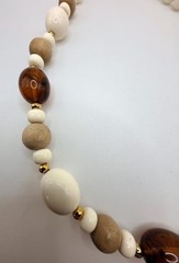 Vintage off white light wood and brown marbled amber colored beaded necklace