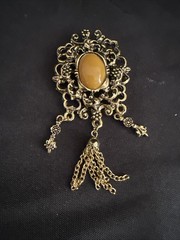 Vintage Gold Tone Dangle Brooch with Brown Cabochon Accent and Tassel Chain