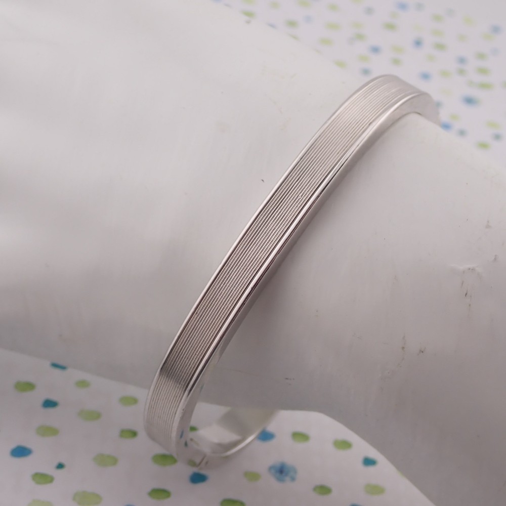 Vintage Monet Oblong Tension Close 6 1/2″ Hinged Silver Tone Bangle Bracelet
