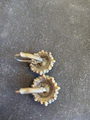 Vintage style costume jewelry earrings featuring a circular halo cluster design