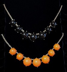 2 Statement Necklaces each 18″-20″ one Black and one Orange.