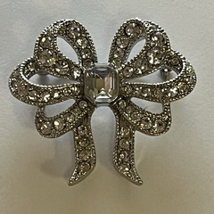 Vintage Monet Clear Rhinestones Bow Brooch Silver Tone Emerald Cut Center Stone