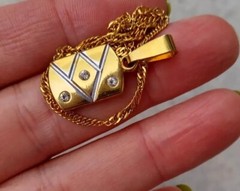 Vintage pendant with chain, golden tone metal